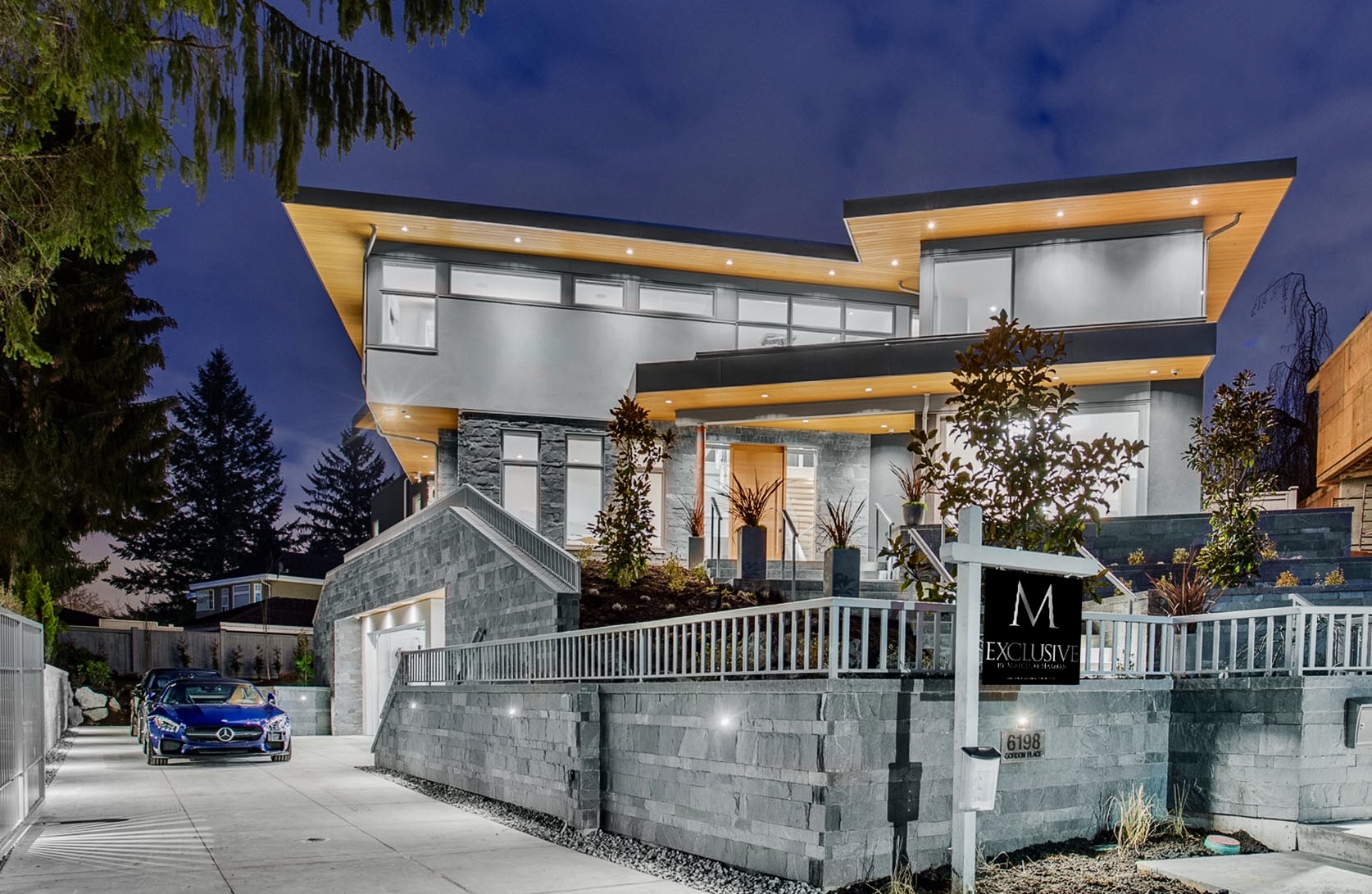 Contemporary custom build exterior at dusk — 6198 Gordon Place