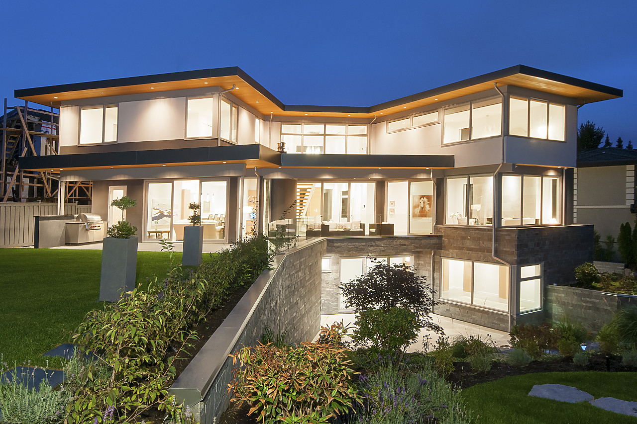 Rear exterior at dusk — illuminated modern contemporary by Twin Peaks Construction