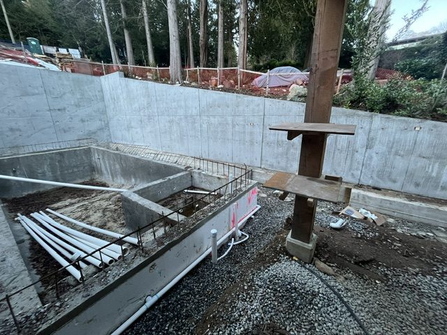 16-foot structural concrete retaining wall and poured pool shell with structural steel column, West Vancouver