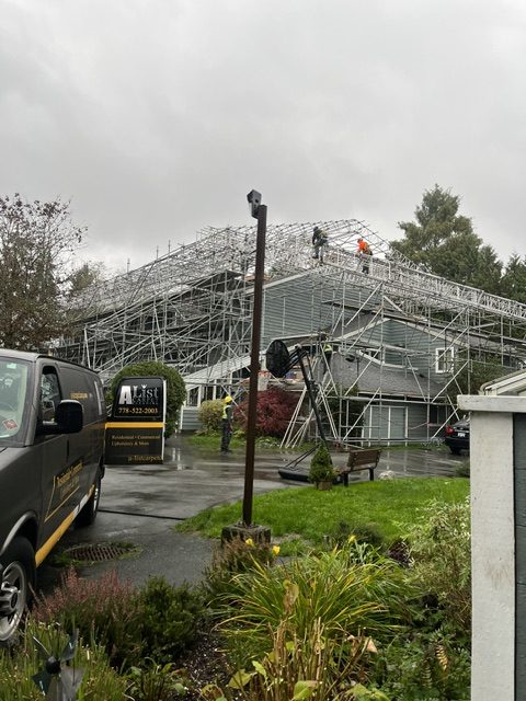 Full scaffolding system erected around the 20-unit North Vancouver multi-family building at the start of the roof upgrade